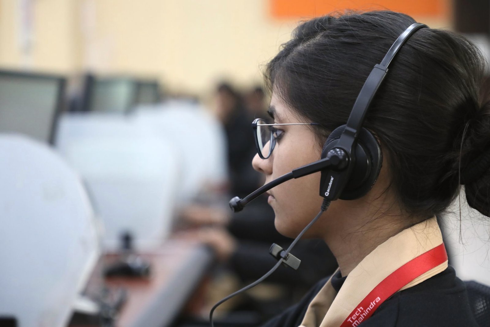 Side profile of an operator wearing a headset.