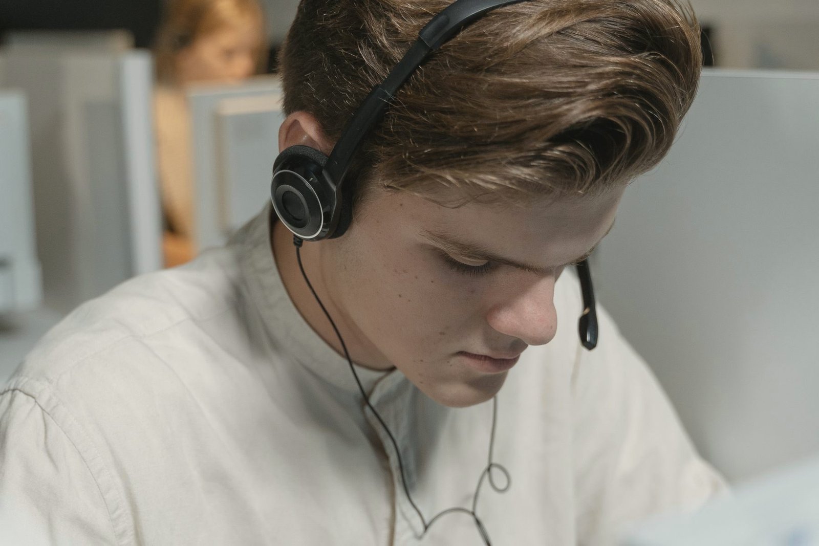 An operator assisting a caller from a desk.