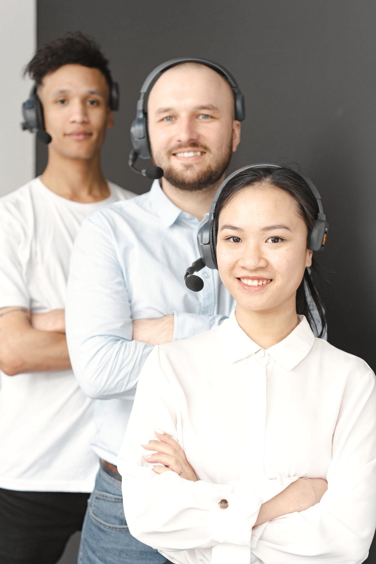 Two operators wearing headsets at their workstation.